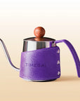 TimeBai fine spout tea kettle in purple with walnut wood knob and leather wrap.