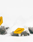 100% plastic-free biodegradable PLA pyramid tea bags with loose leaf tie guan yin oolong tea with pomelo blossom.