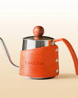 TimeBai 350ml pour-over kettle in vibrant orange with an insulated leather sleeve.
