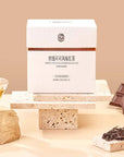 Timebai Chocolate Black Tea product set showing the packaging, oolong leaves, chocolate and brewed tea.
