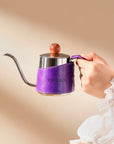 Handheld TimeBai kettle with comfortable leather grip.