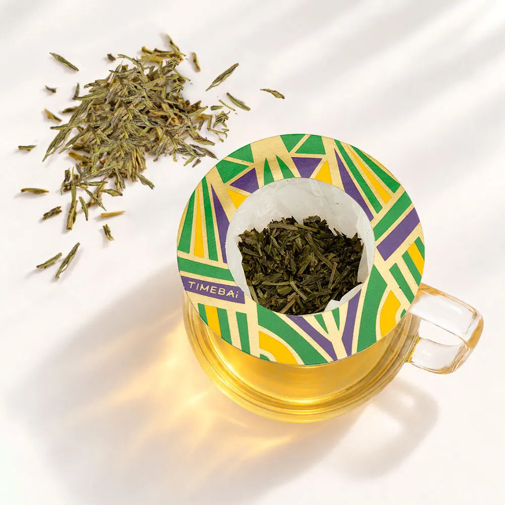 Timebai Longjing Dragon Well Green Tea Brewing in a Glass Cup with a Hanging Filter Bag