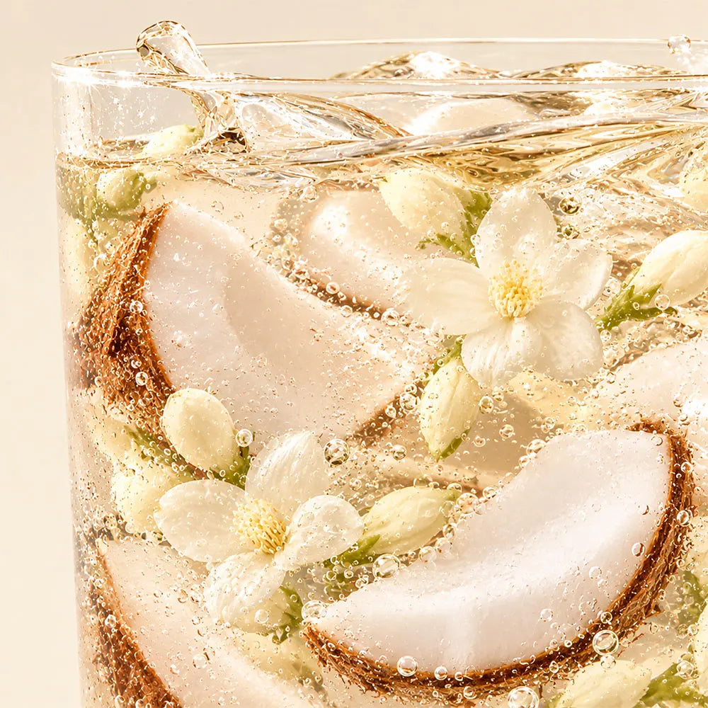 Timebai_Coconut_Jasmine_Tea_coconut_slices_and_jasmine_flowers_in_iced_golden_tea