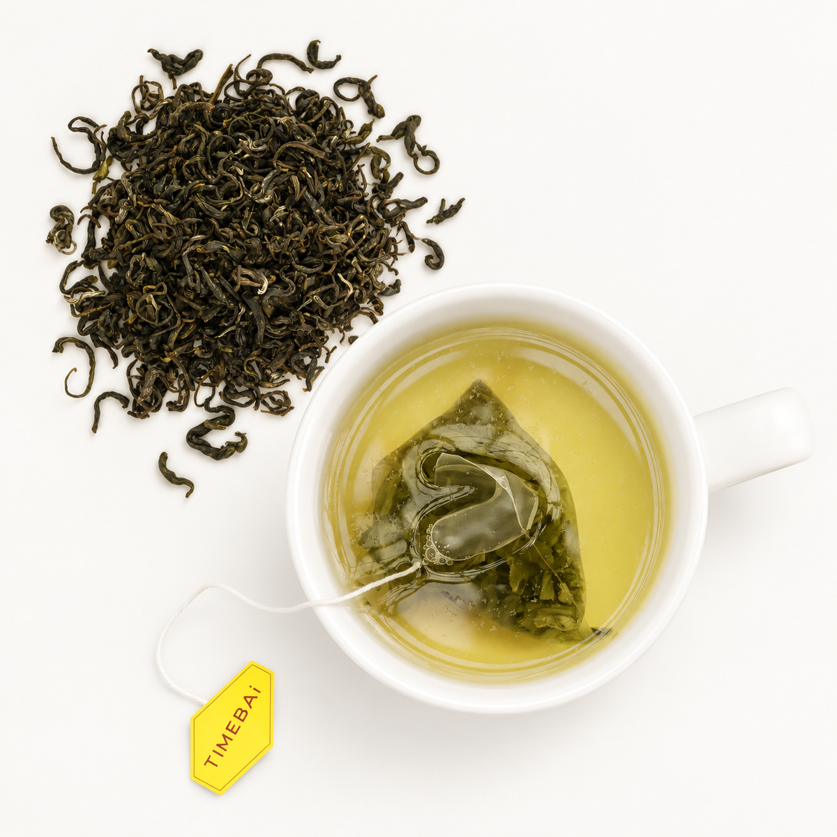 Timebai Orchid Bi Luo Chun Green Tea Brewing in a White Cup Beside Loose Tea Leaves