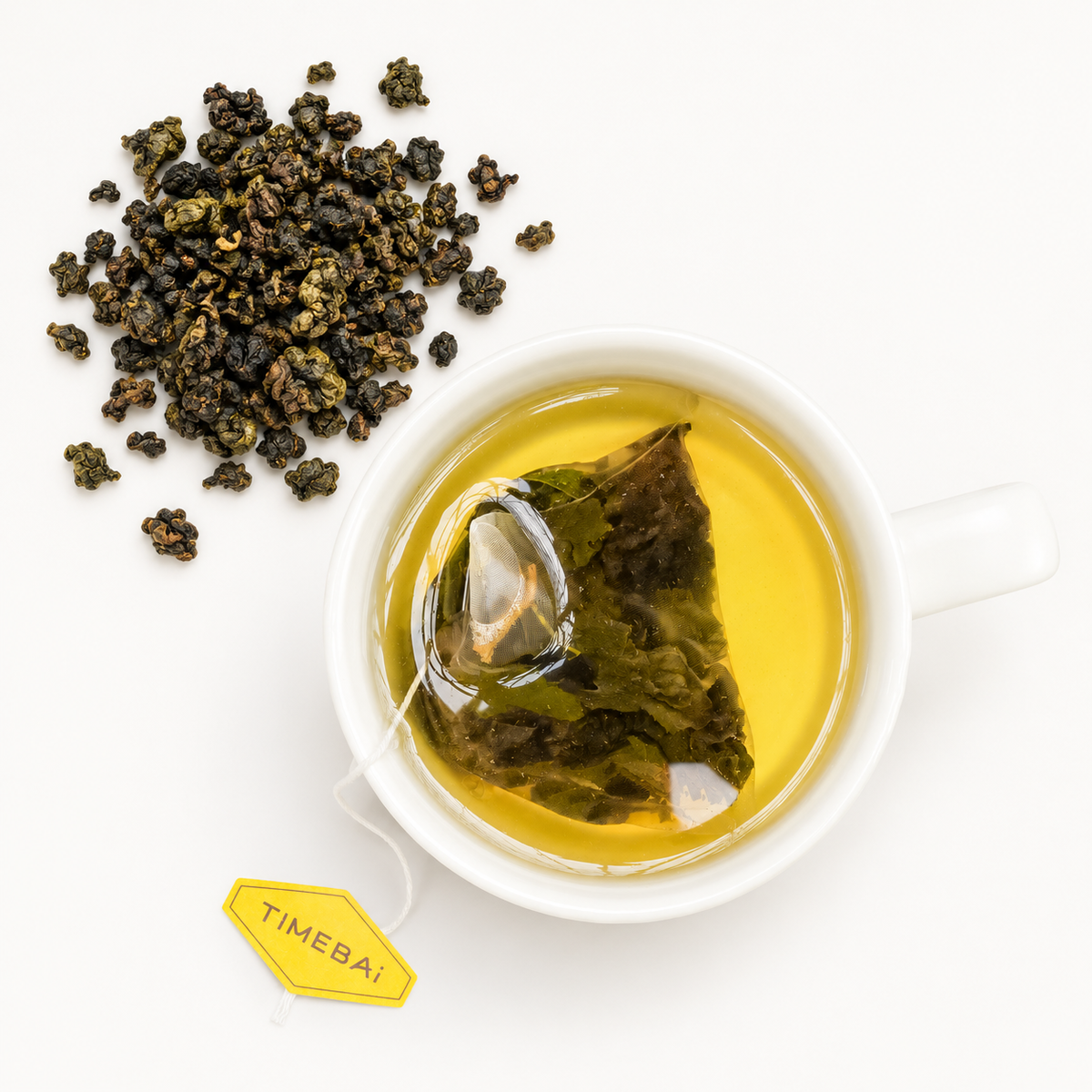 Timebai Pomelo Oolong Tea Brewing in a White Cup Beside Loose Tea Leaves