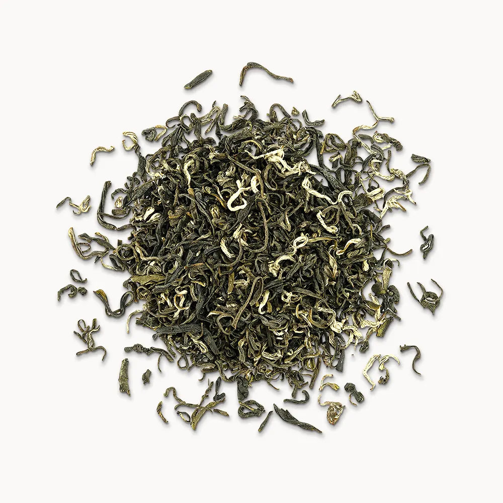 Timebai early spring bi luo chun green tea loose leaves piled on a white background.