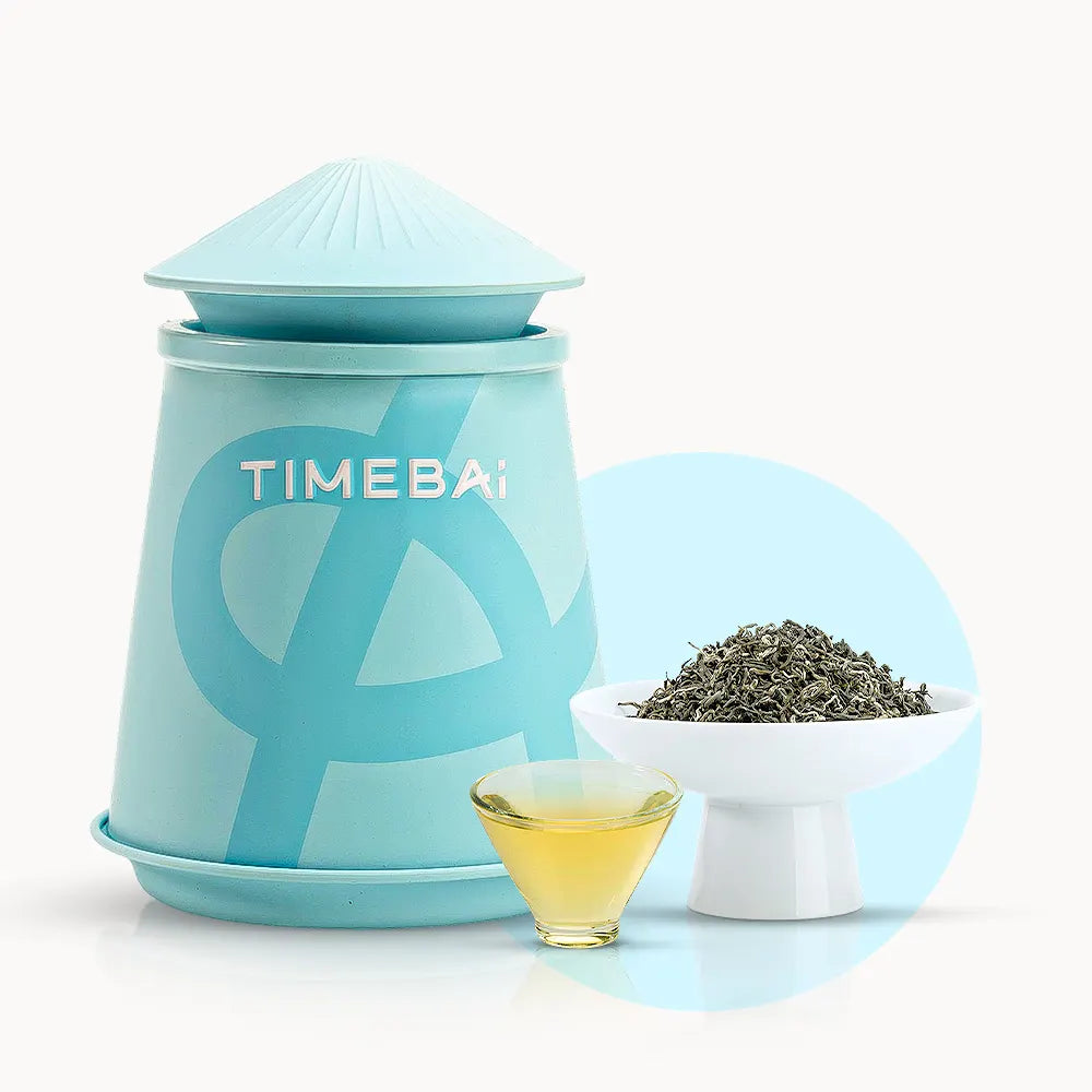 Timebai early spring bi luo chun green tea with a turquoise tea canister, loose leaves in a white bowl, and a glass cup of pale yellow tea on a white background..