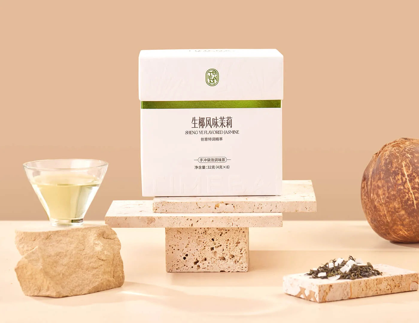 Timebai Coconut Jasmine Green Tea product set showing the packaging, green tea leaves, coconut flakes and brewed tea.