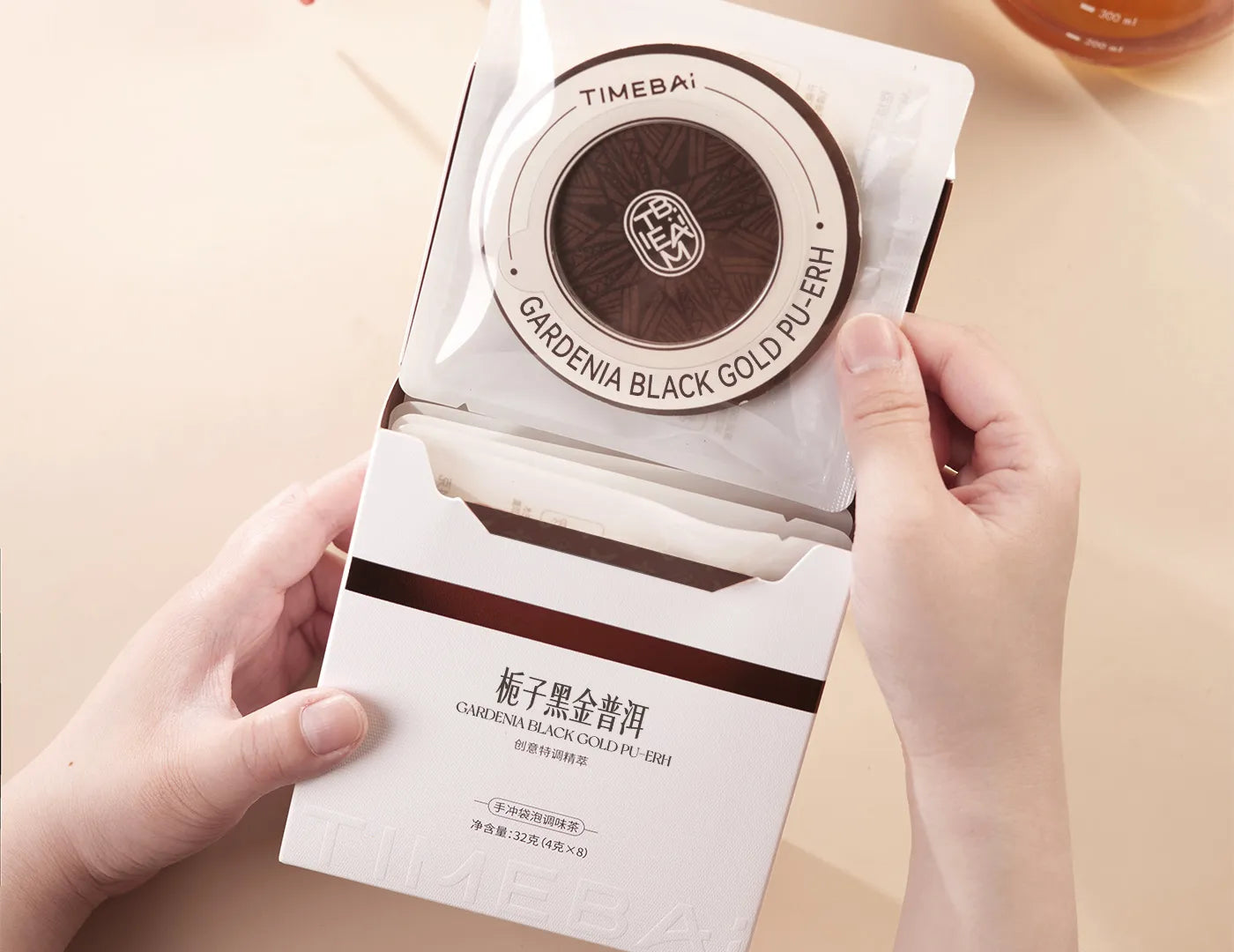 Retail box of Timebai Gardenia flavored Pu-erh Tea containing 8 individual UFO tea bag.