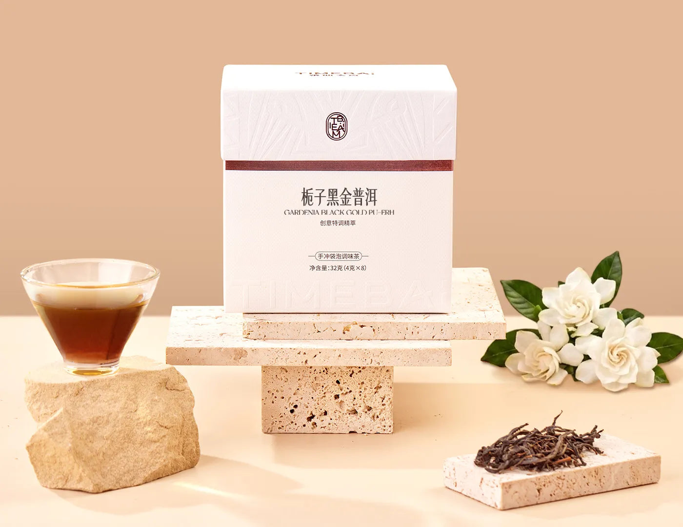 Timebai Gardenia Pu-erh Tea product set showing the packaging, pu-erh leaves, gardenia flowers and brewed tea.