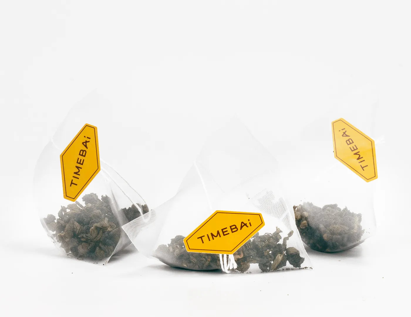 100% plastic-free biodegradable PLA pyramid tea bags with loose leaf tie guan yin oolong tea with pomelo blossom.