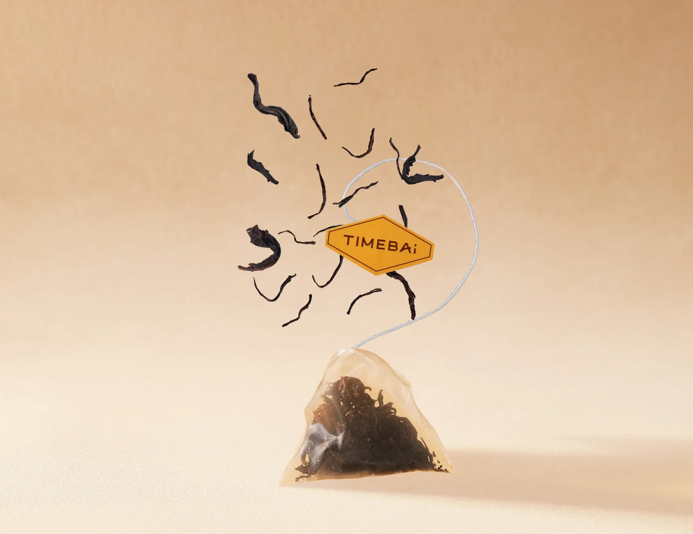 Biodegradable PLA pyramid tea bags with whole-leaf Jin Mudan black tea and dried rose.