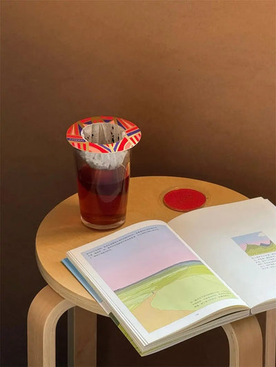 Relaxing tea moment with TimeBai drip disc and reading book