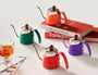 TimeBai kettle colors: orange, green, purple, and red.