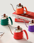 TimeBai kettle colors: orange, green, purple, and red.