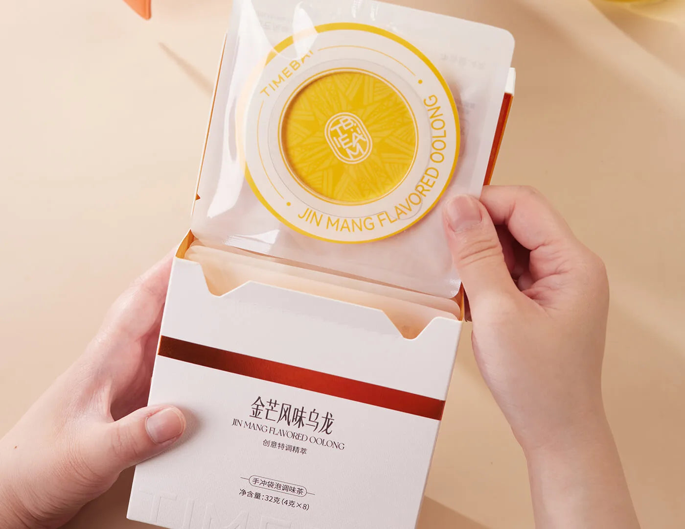 Retail box of Timebai mango flavored Tea containing 8 individual UFO tea bag.