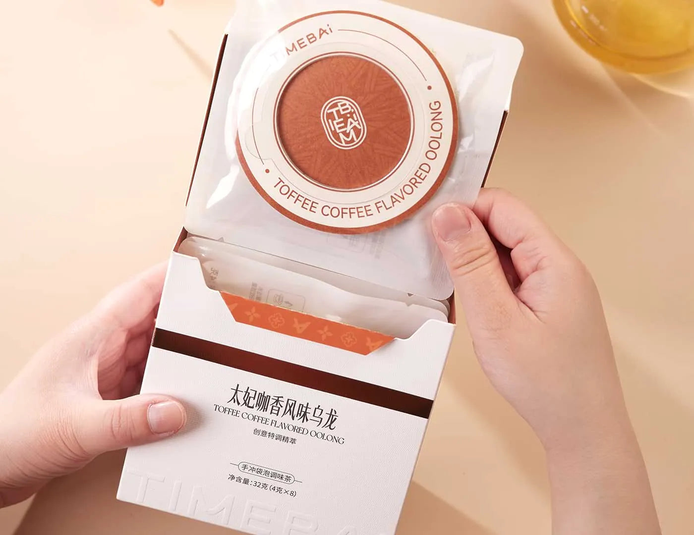 Retail box of Timebai toffee coffee flavored Tea containing 8 individual UFO tea bag.