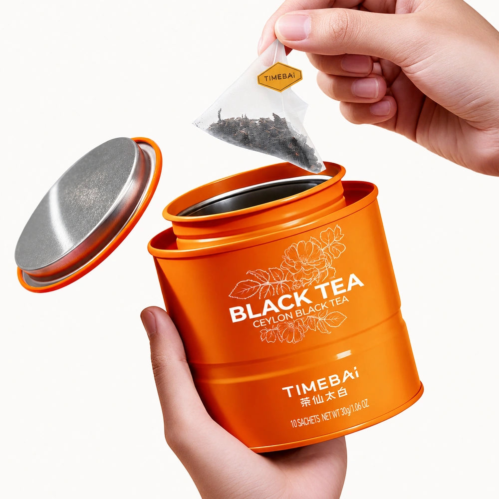 Timebai Ceylon Black Tea – Hand Lifting a Pyramid Tea Bag from an Open Tin